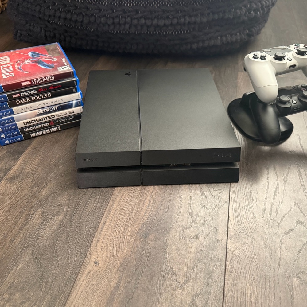 Sony PlayStation 4 with 2 Controllers and 8 Games